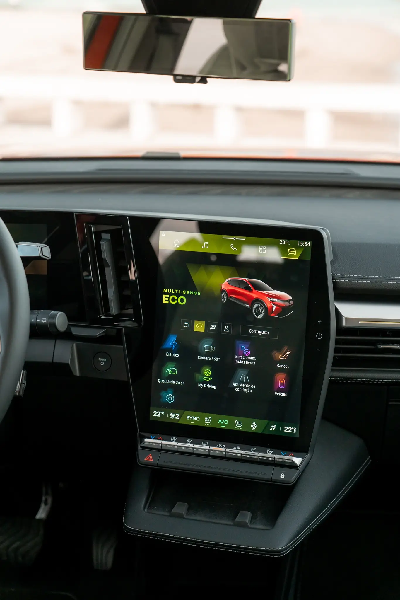 The central screen of the infotainment system displays the Eco mode page